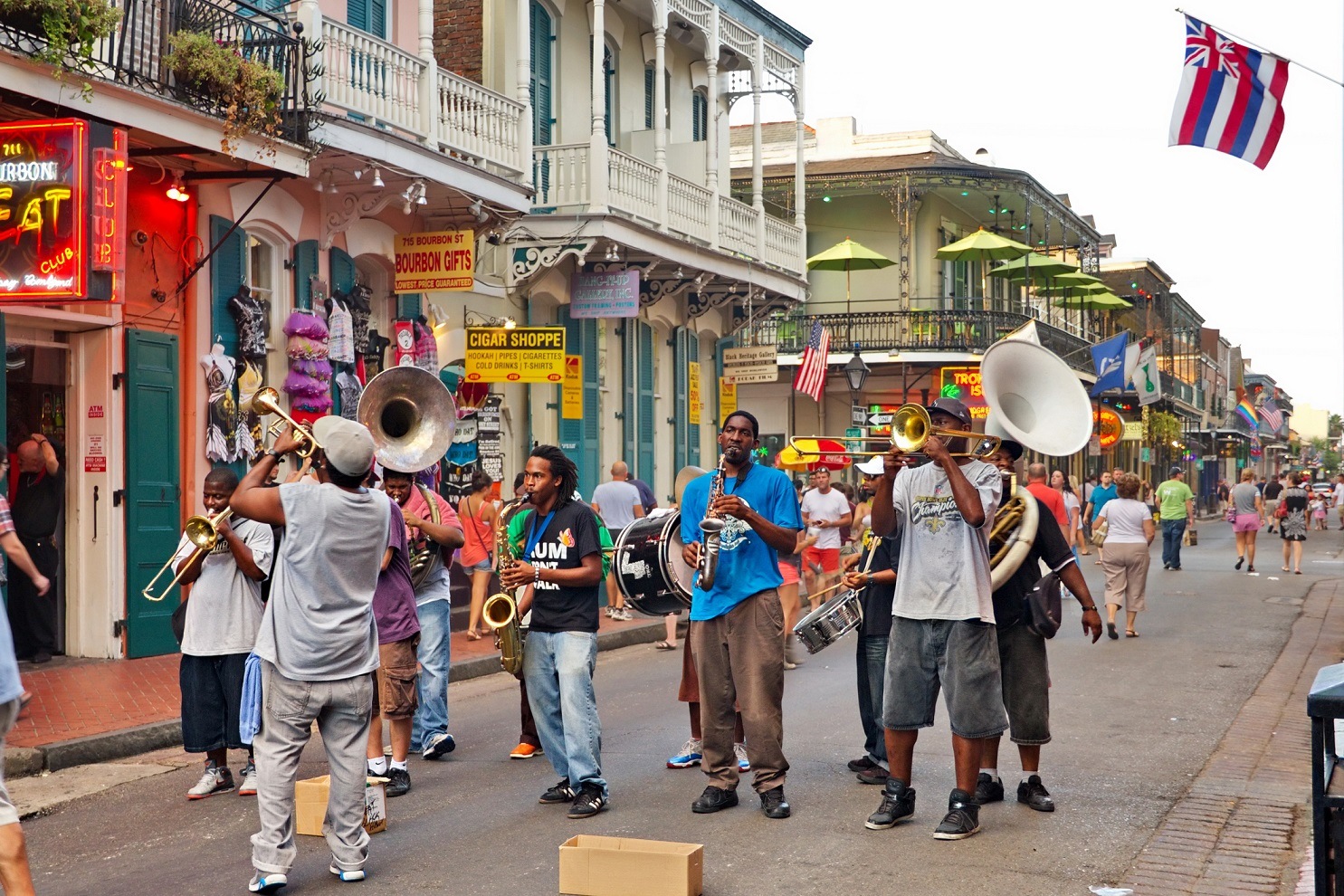 In New Orleans on Bourbon St. on August 7, 2013 a jazz band plays jazz melodies in the street for donations from the tourists and locals passing by on this hot summer evening