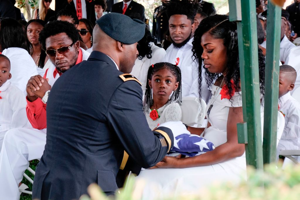 Widow of Niger ambush victim holds American flag