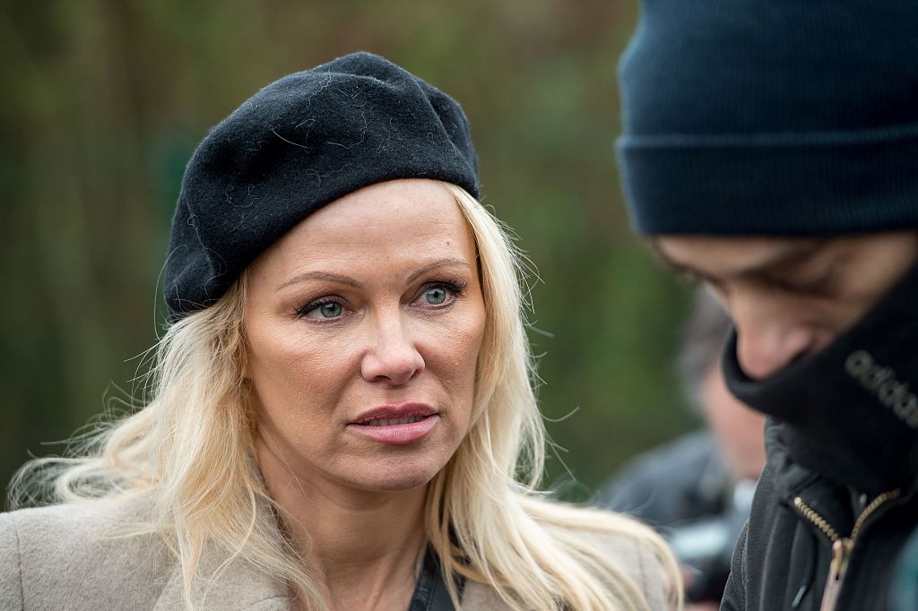 Pamela Anderson speaks with people in the migrant and refugee camp of Grande-Synthe in northern France.