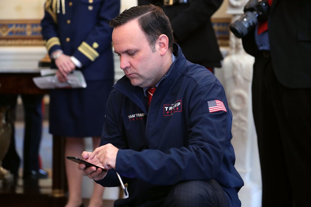 President Trump Hosts NCAA National Championship Teams To The White House White House social media director Dan Scavino Jr. works two phones