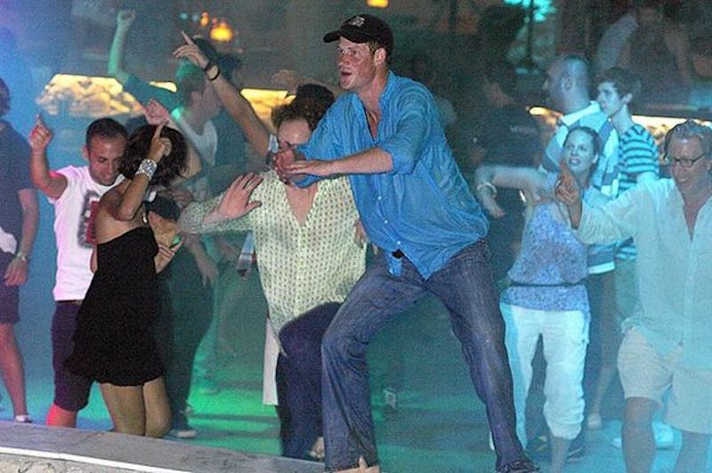 Prince Harry dancing in a pool with other party goers. Prince Harry dancing in a pool with other party goers.