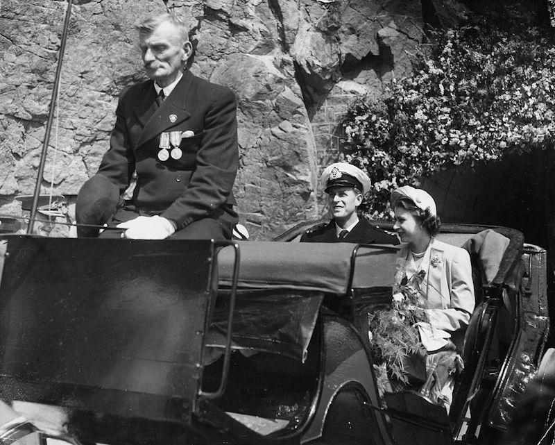 Princess Elizabeth and Prince Philip, the Duke of Edinburgh, riding in a carriage at they tour the island of Sark, Guernsey, circa 1948.
