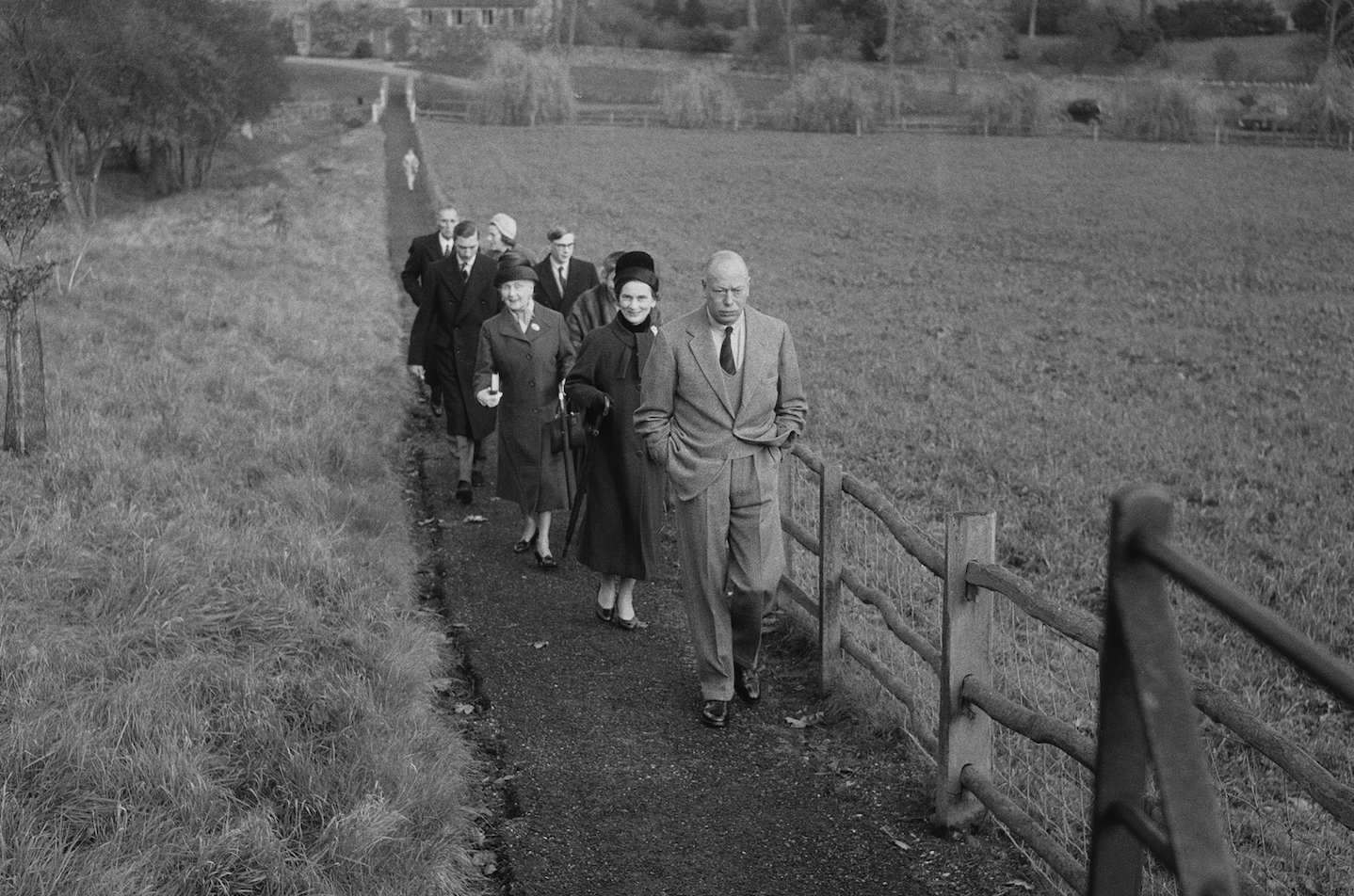 Princess Alice walks alongside Prince Henry through a farm. Princess Alice walks alongside Prince Henry through a farm.