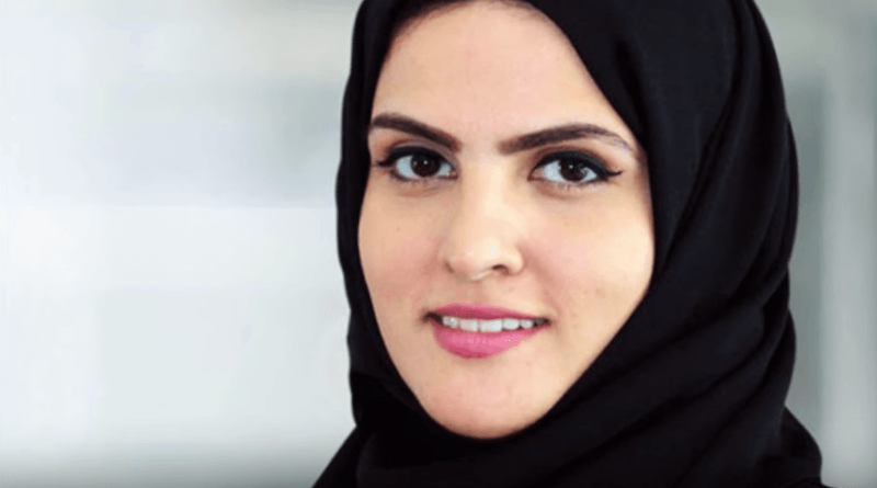 Princess Sheikha smiles in front of a white background. Princess Sheikha smiles in front of a white background.