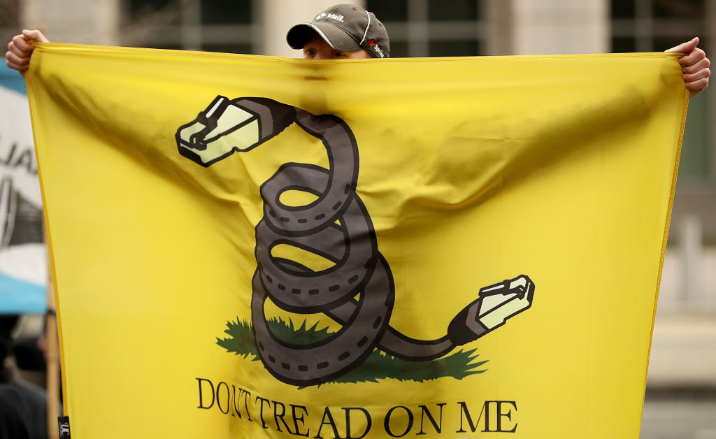 Demonstrators rally outside the Federal Communication Commission building