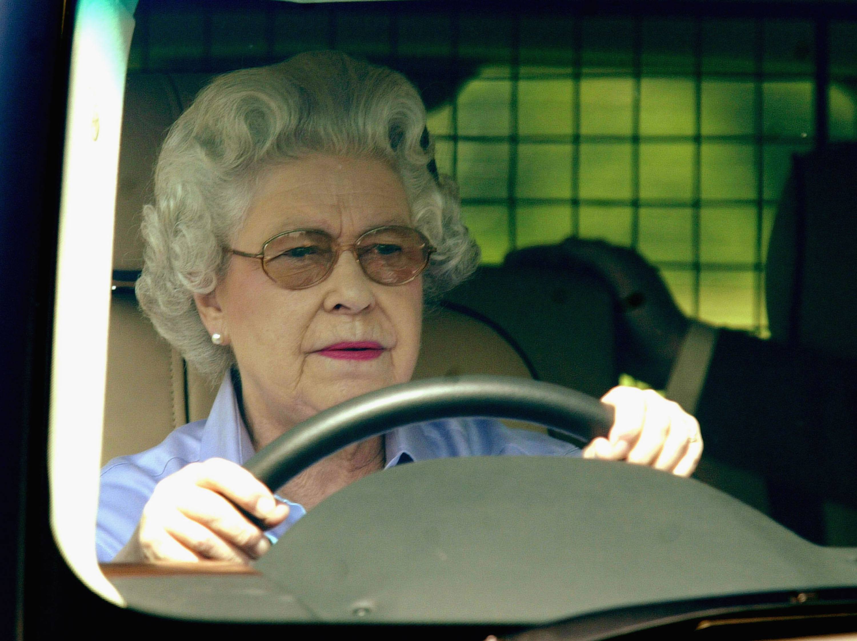 Queen Elizabeth driving her SUV