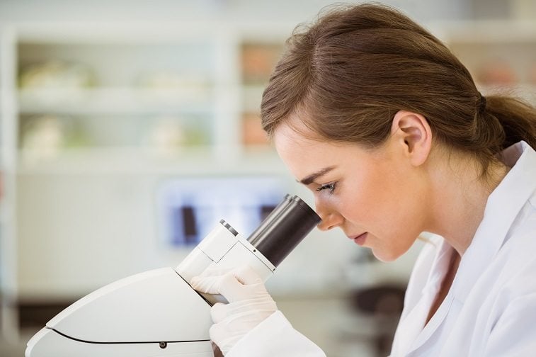 Scientist with microscope