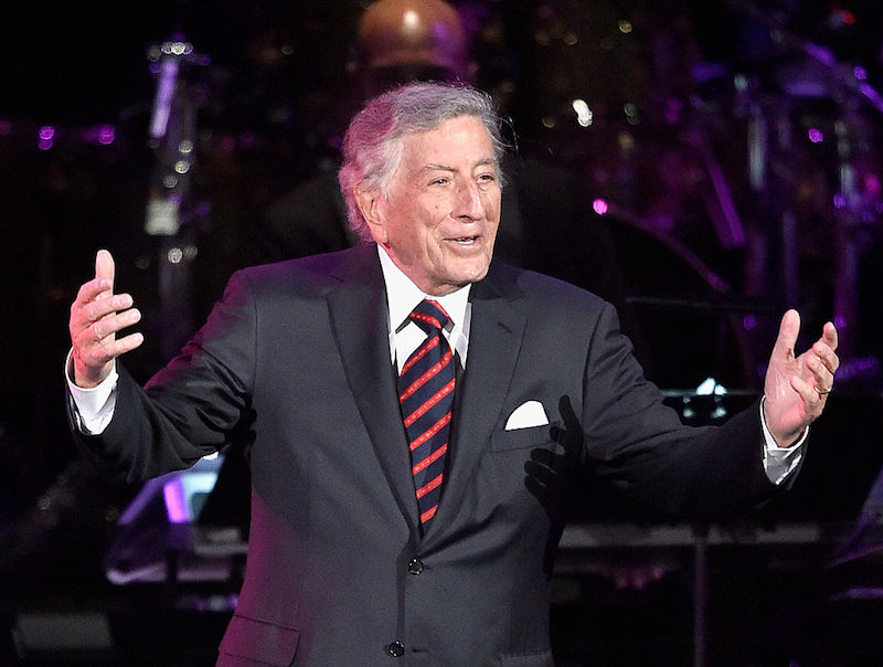 Tony Bennet on stage performing. Tony Bennet on stage performing.