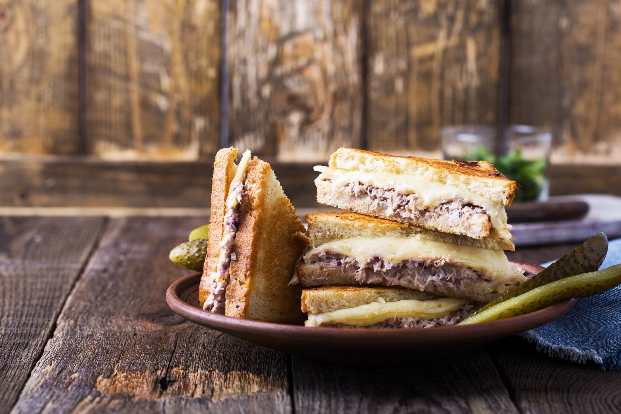 Homemade tuna melt sandwich on rural table
