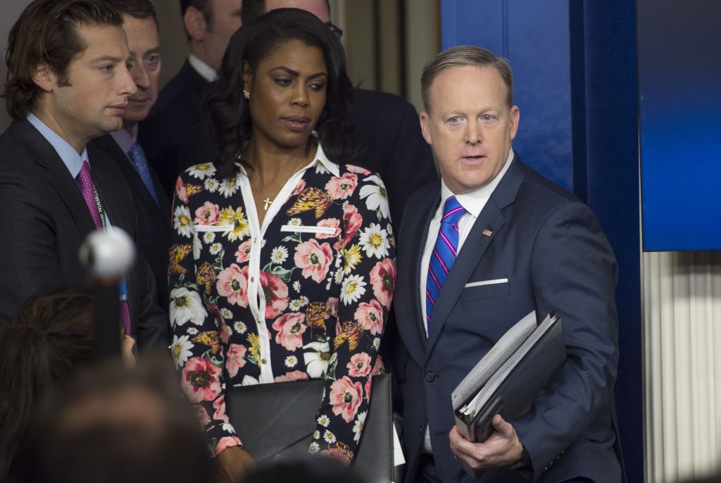 White House Press Secretary Sean Spicer (R) arrives alongside Omarosa Manigault for the daily press briefing at the White House