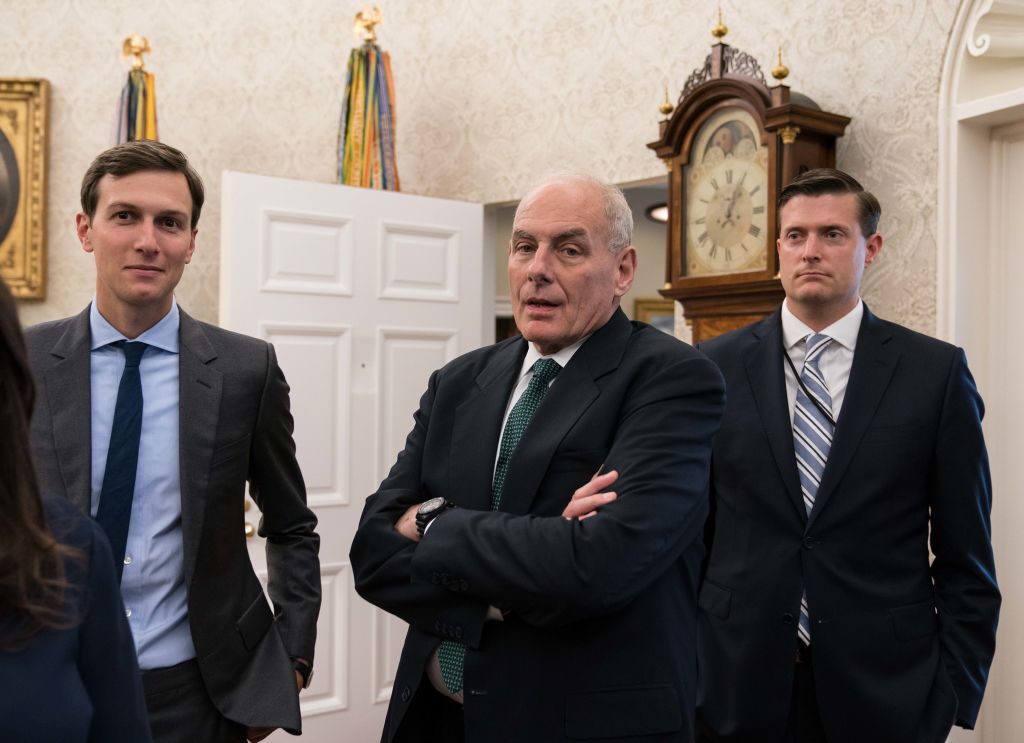 White House senior adviser Jared Kushner (L), chief of staff John Kelly (C) and staf secretary Rob Porter look on after US President Donald Trump signed a proclamation