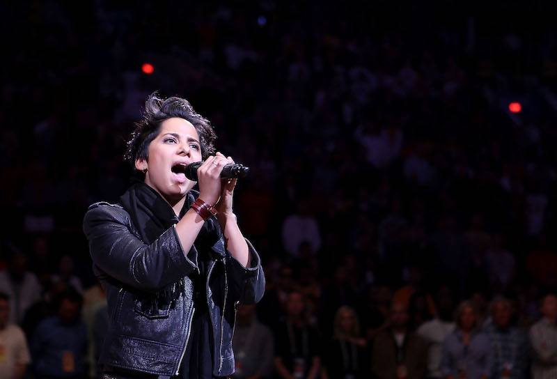 Vicci Martinez performing behind a microphone. Vicci Martinez performing behind a microphone.