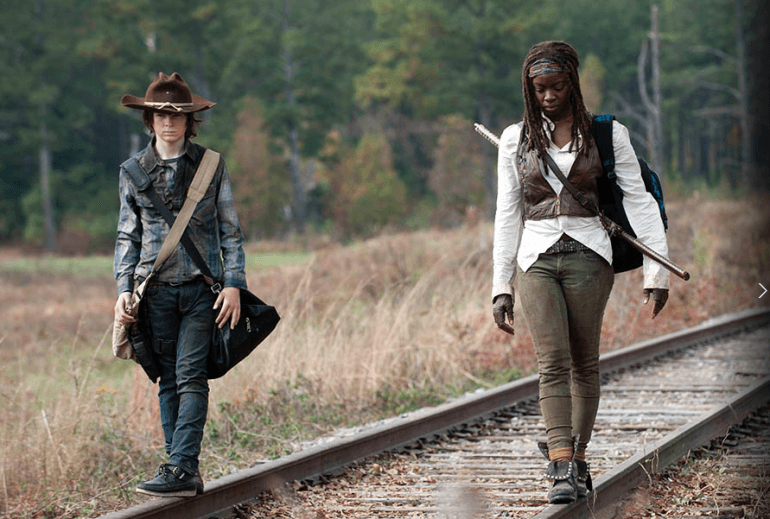 Carl and Michonne walk side by side