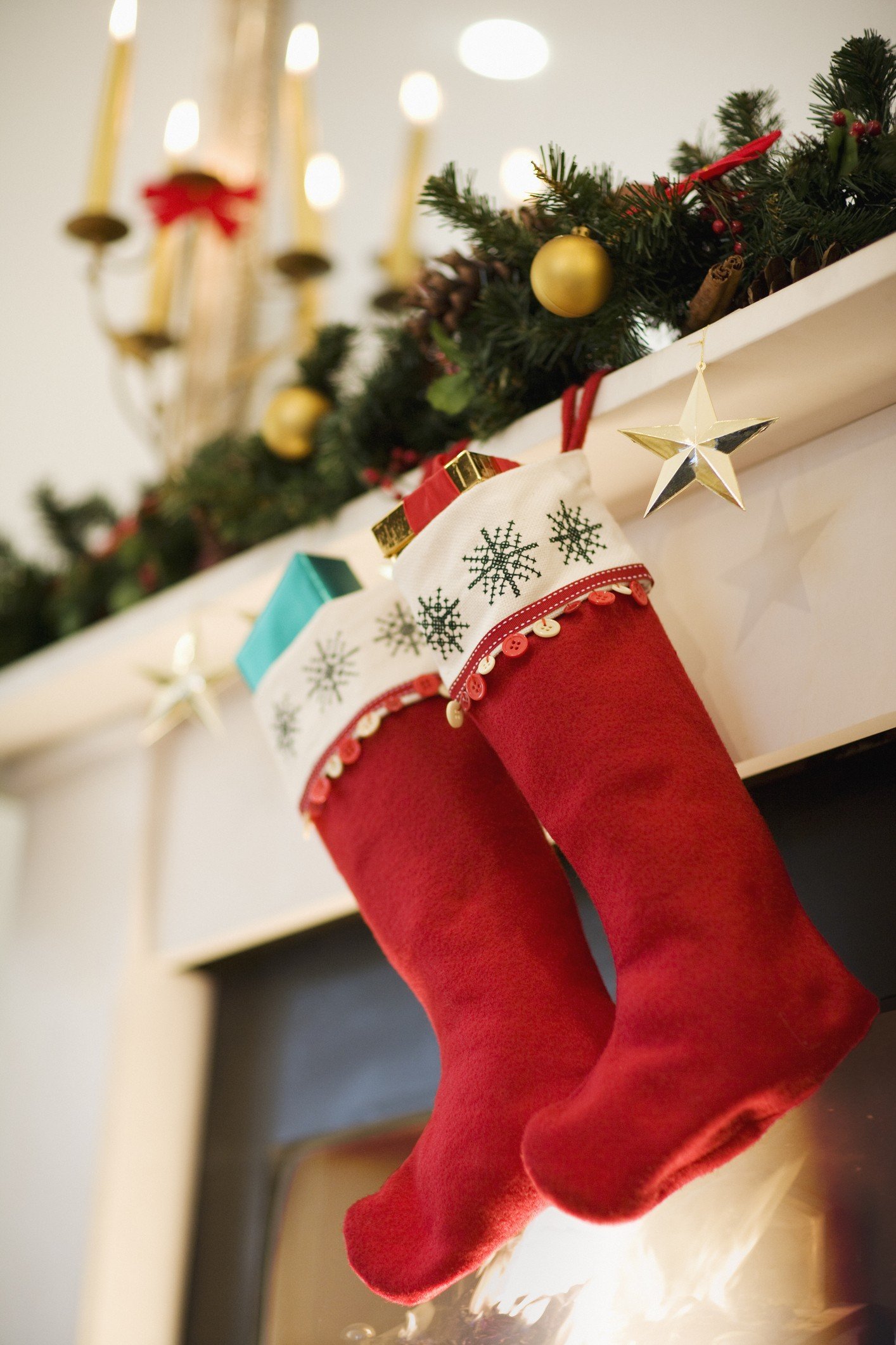 Christmas stockings hanging on fireplace mantel