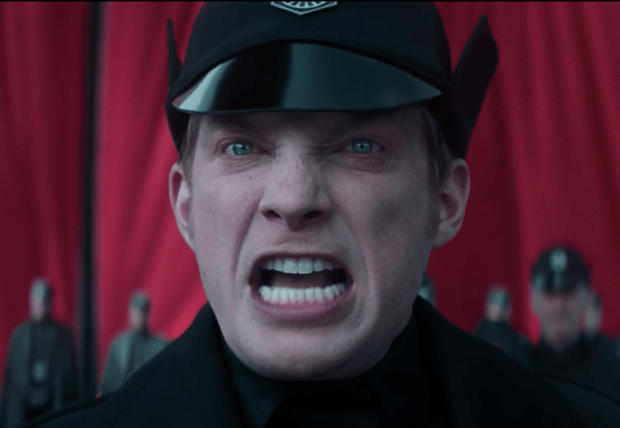 General Hux stares ahead with an angry look in Star Wars: The Force Awakens General Hux stares ahead with an angry look in Star Wars: The Force Awakens