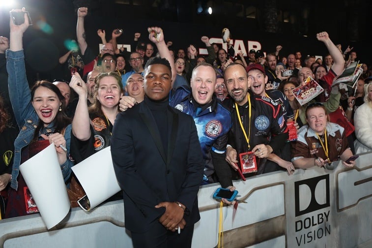 John Boyega poses with fans on the red carpet John Boyega poses with fans on the red carpet