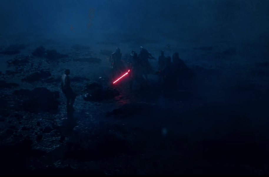 The Knights of Ren hold a glowing red lightsaber in Star Wars: The Force Awakens