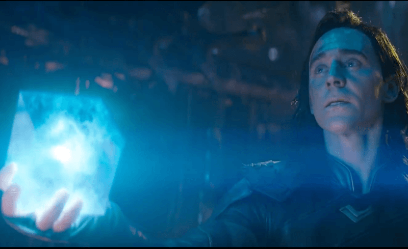 Loki holds up the Tesseract