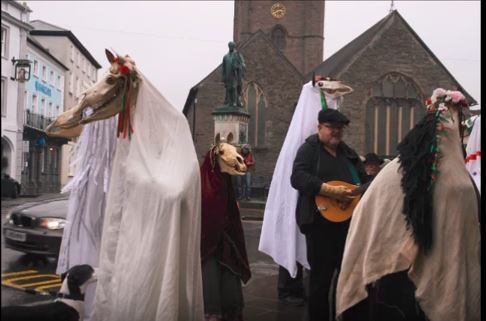 A group of Mari Wyd dance with revelers in Wales A group of Mari Wyd dance with revelers in Wales