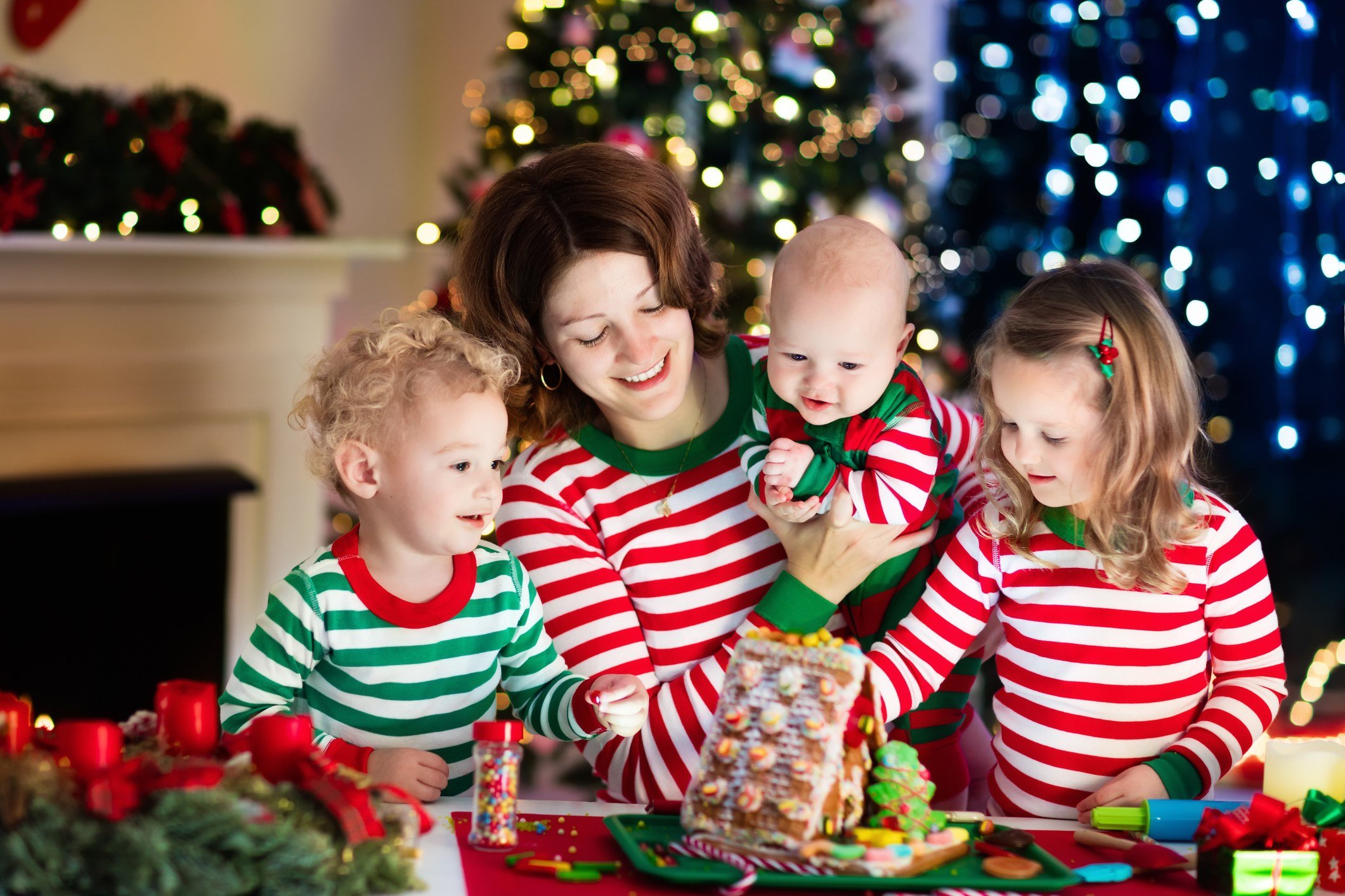 Mother and kids in matching Christmas pajamas