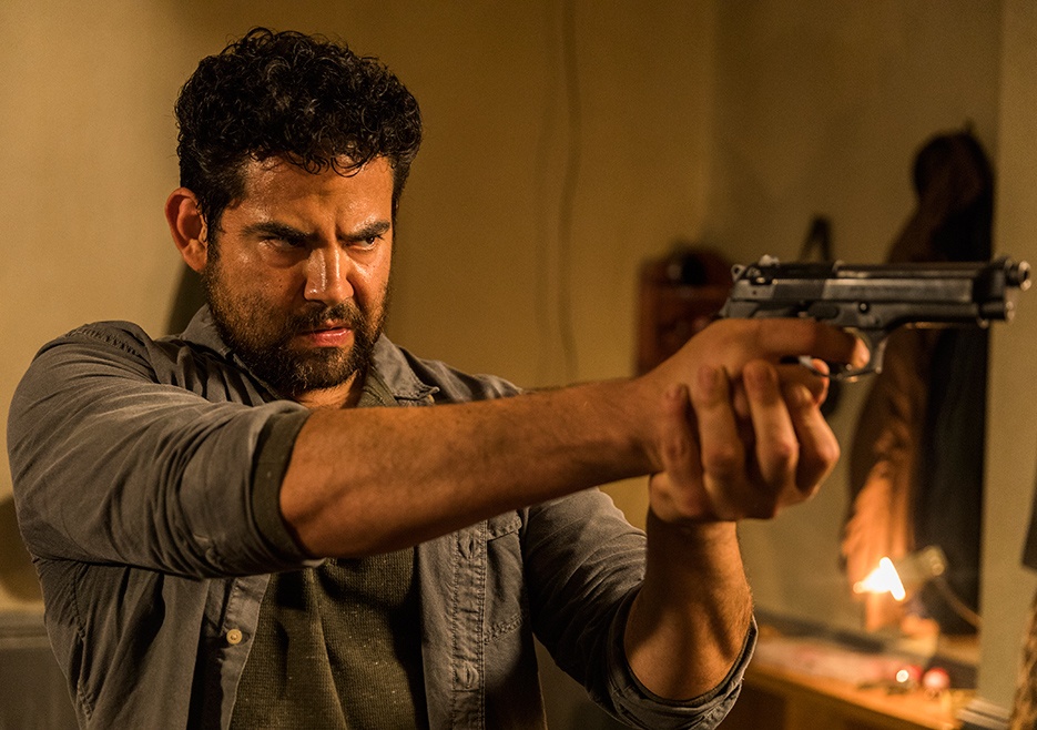 Morales holds up a gun Morales holds up a gun