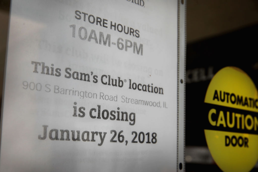 A sign hangs on the door of a Sam's Club store in Streamwood, Illinois
