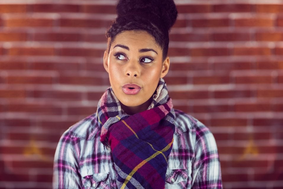 A beautiful happy hipster whistling