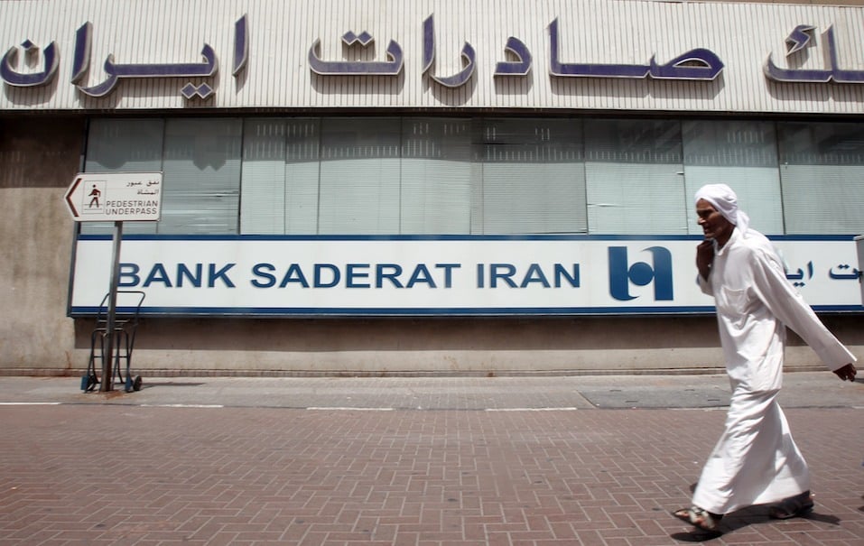 A man walks past Bank Saderat Iran one of the Islamic republic's top trading partners
