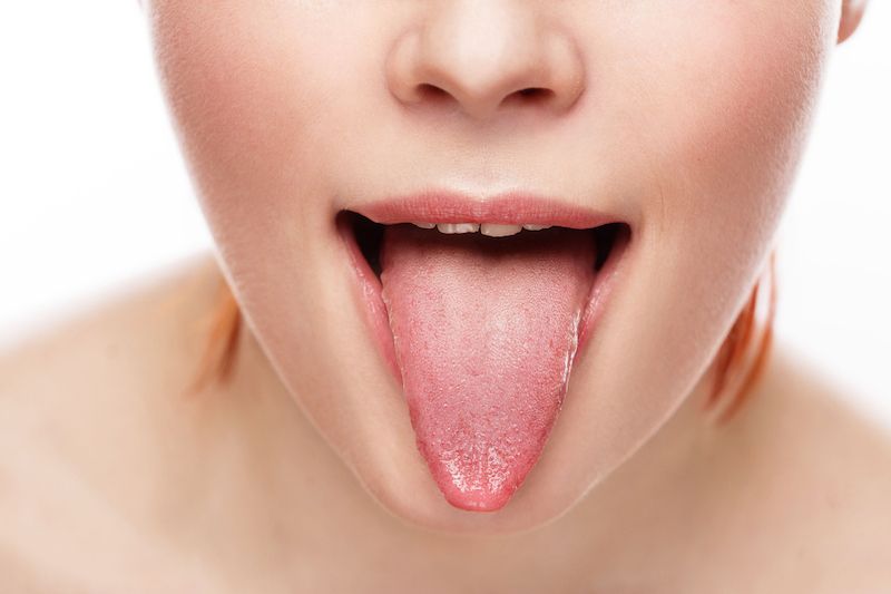 A woman sticking her tongue out A woman sticking her tongue out