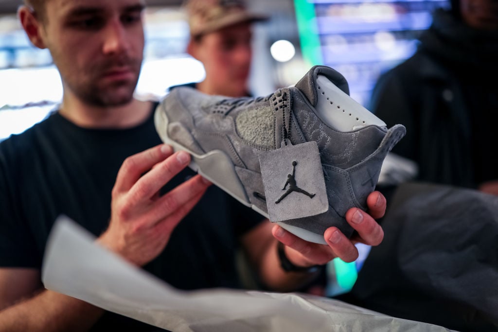 A customer looks at a new Air Jordan sneaker for sale.