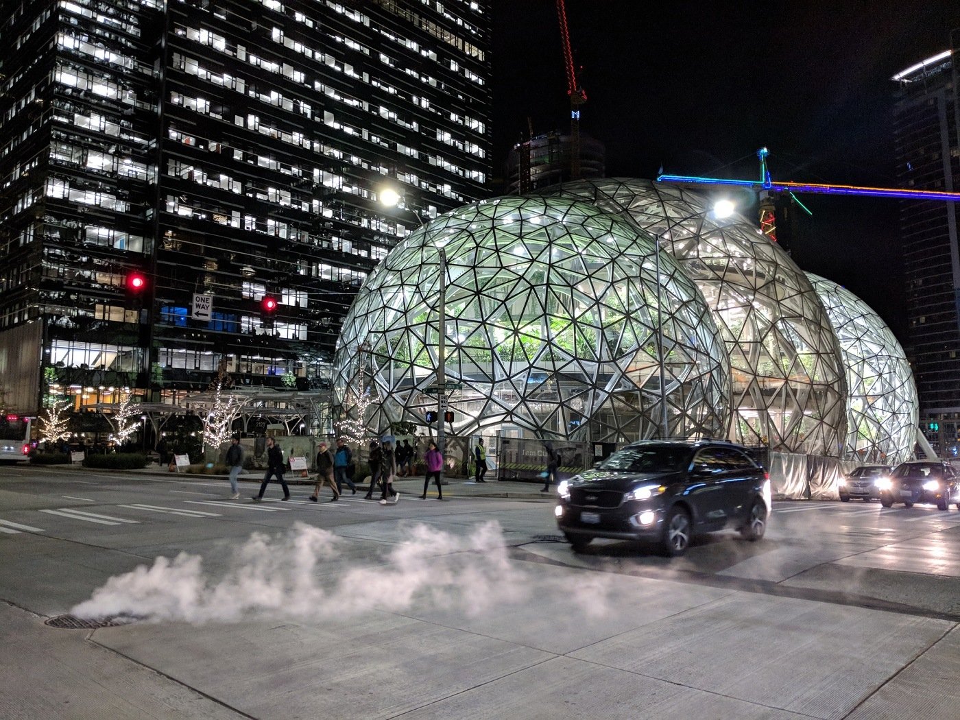 Workers Leave the Offices Outside Amazon Headquarters and Biosphere Domes