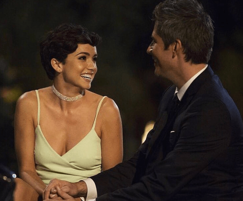 Bekah Martinez smiles as she stares at Arie. 
