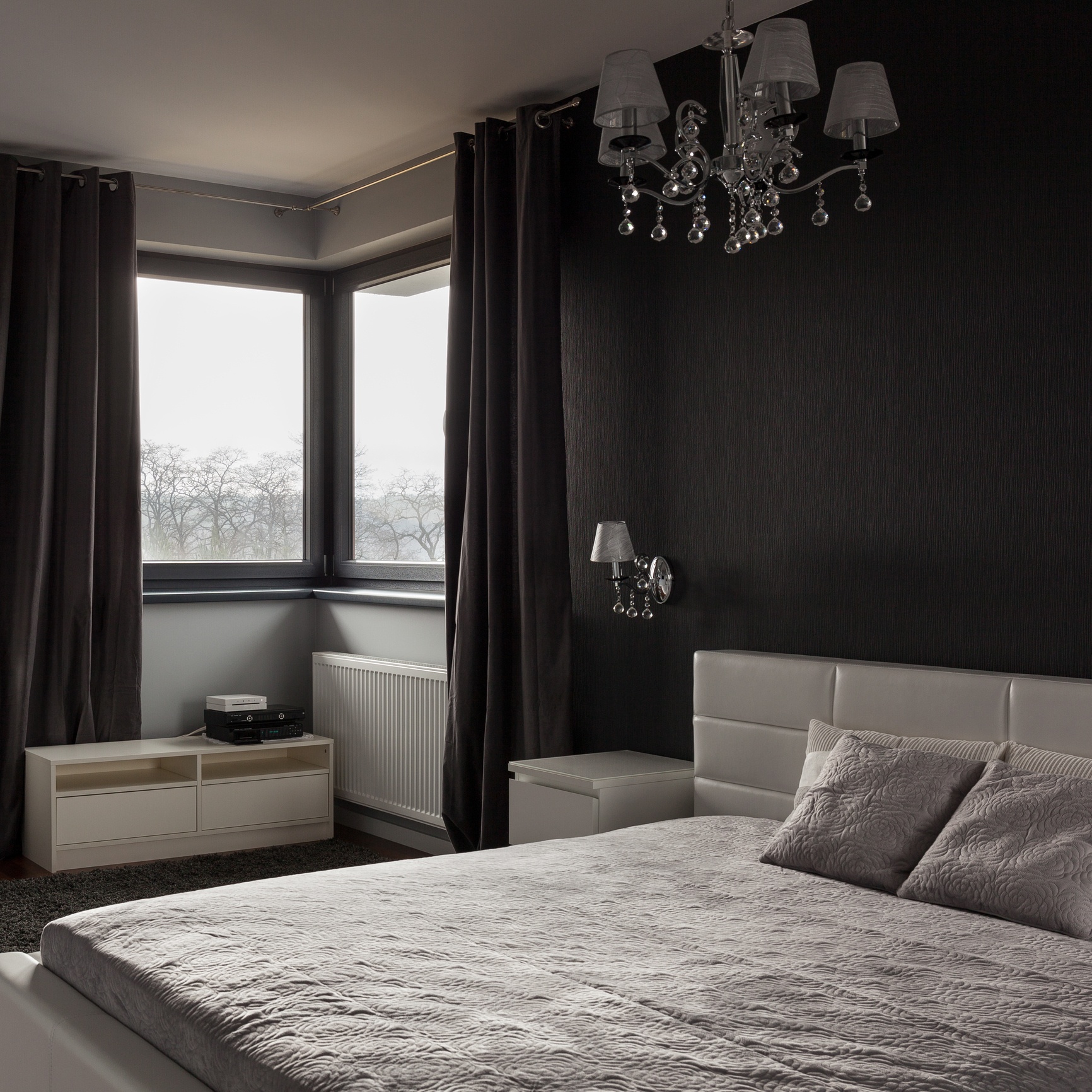 Dark bedroom with black accent wall