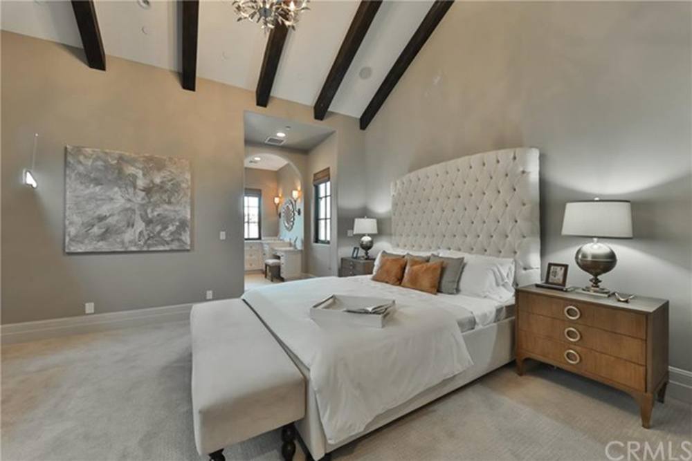 Britney Spears' guest bedroom with high ceilings with beams