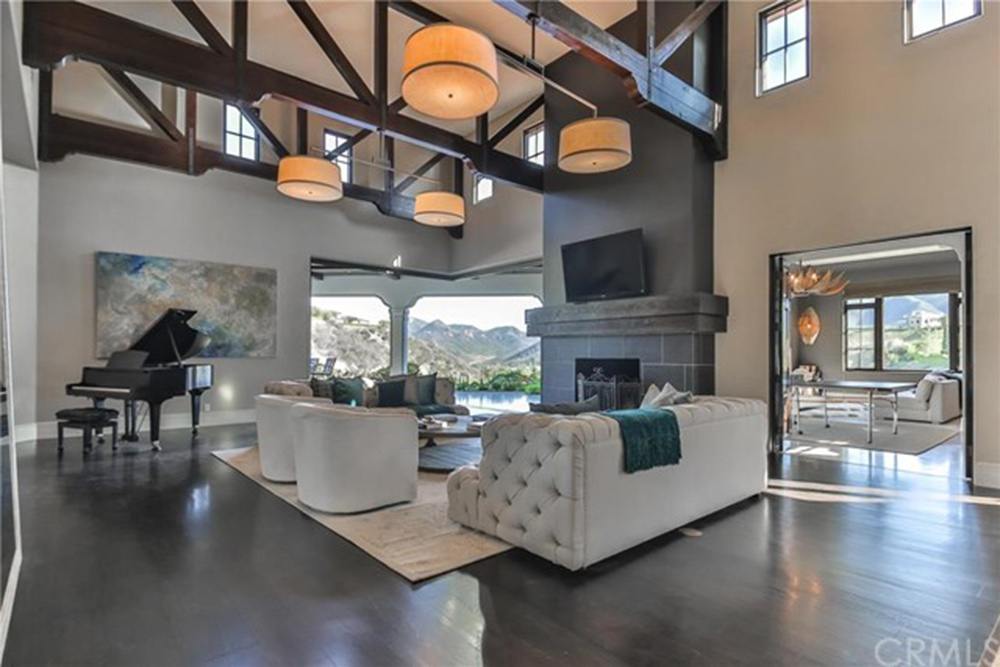 Britney Spears' living room with high ceilings and fireplace