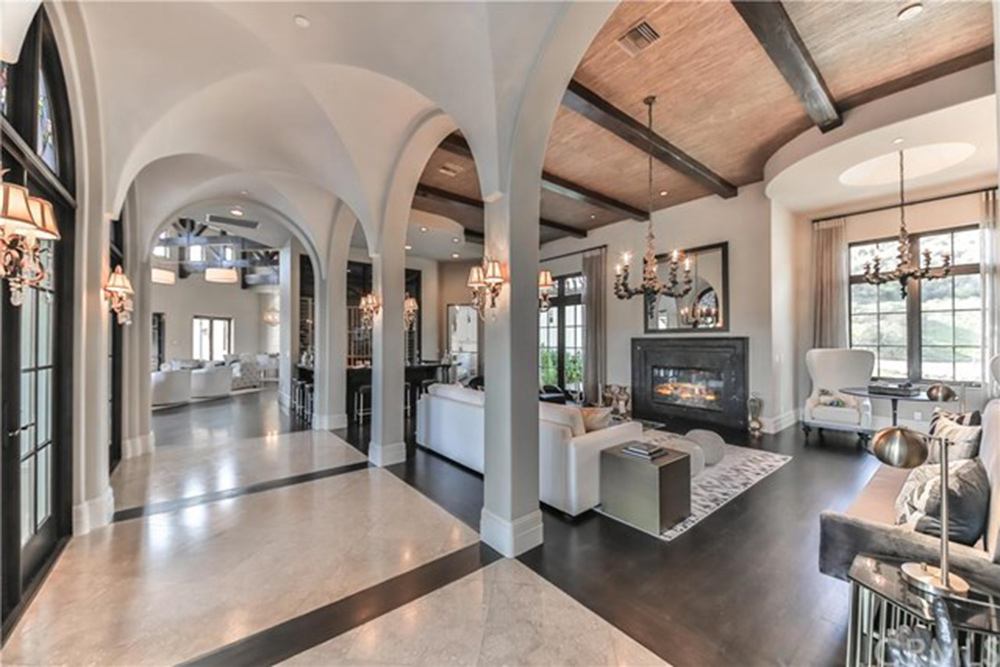 Britney Spears' living room with arched openings and a fireplace