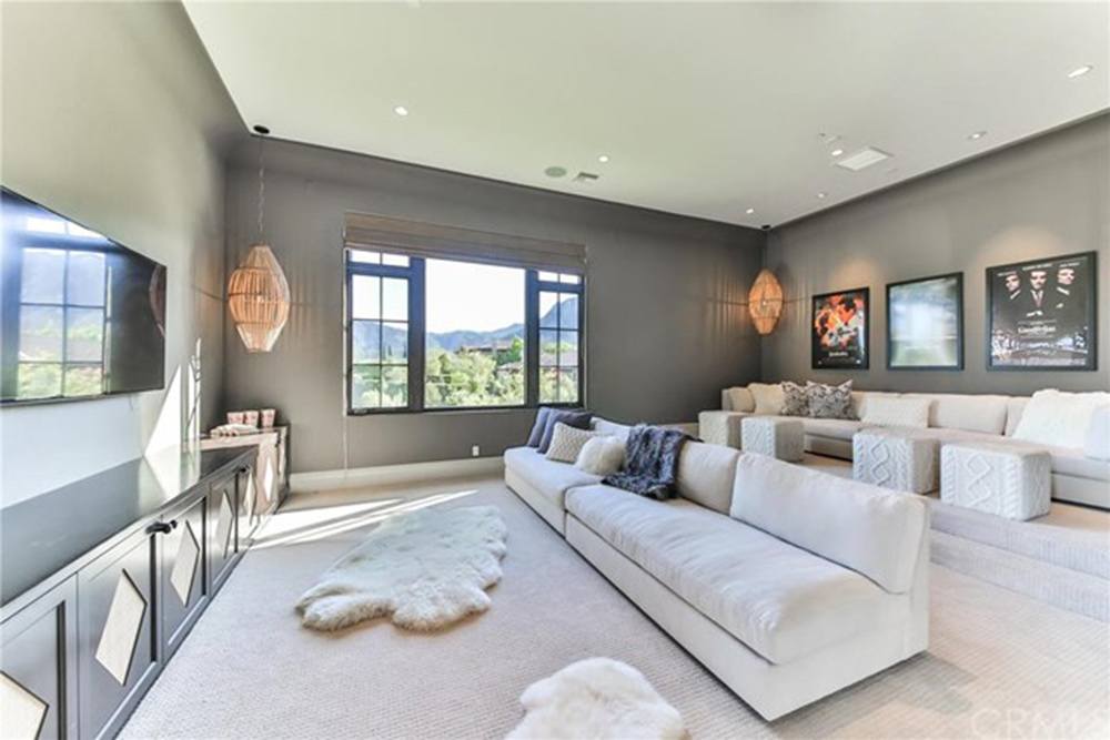 Britney Spears' movie theater with long white couches