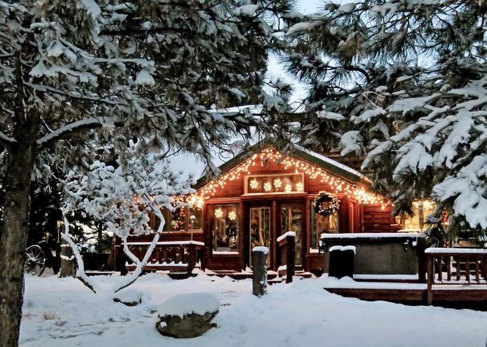 Christmas lights on wooden cabin