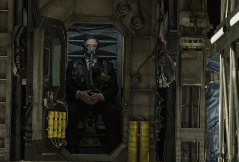 John Goodman wearing a face mask and tube in 'Captive State'.