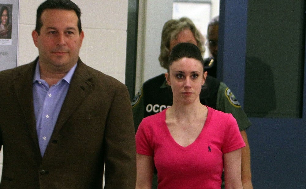 Casey Anthony (R) leaves with her attorney Jose Baez