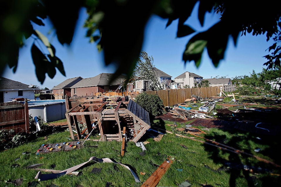 A playground set lays on the ground in the backyard of a home on W. Daisy Place