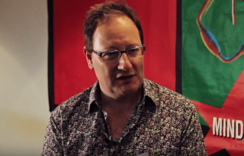 Chris Chibnall sitting during an interview. Chris Chibnall sitting during an interview.