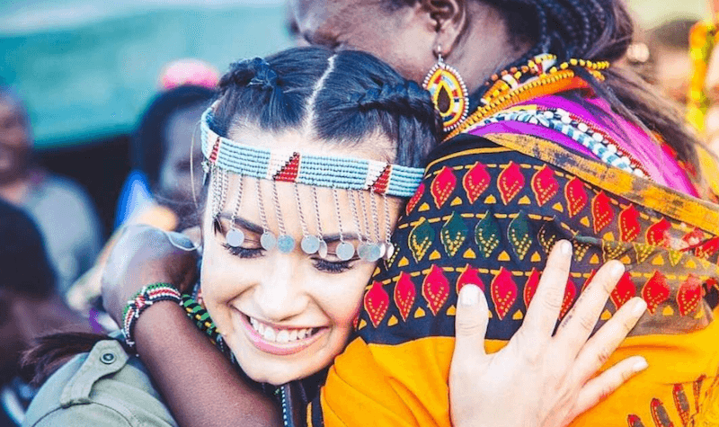 Demi Lovato smiles and hugs a woman. Demi Lovato smiles and hugs a woman.