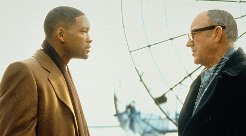 Will Smith and Gene Hackman talking in front of a large wheel in 'Enemy State of Mind'. Will Smith and Gene Hackman talking in front of a large wheel in 'Enemy State of Mind'.