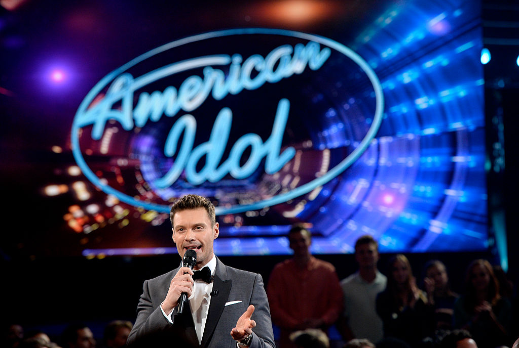 Host Ryan Seacrest speaks in the audience during FOX's 'American Idol' Finale For The Farewell Season