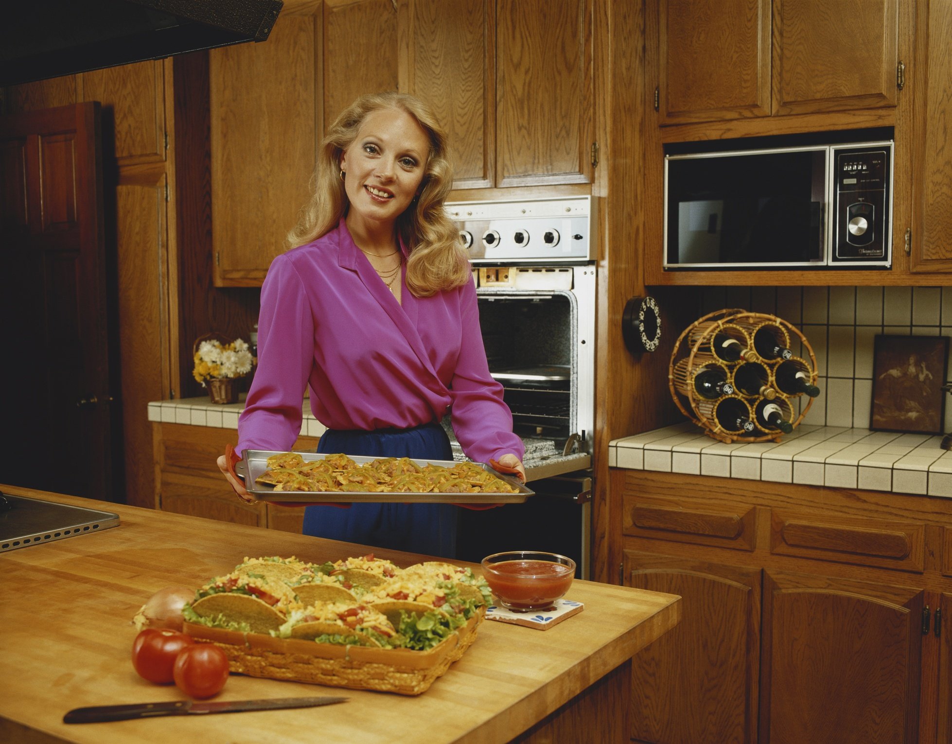 woman cooking in 1980s kitchen