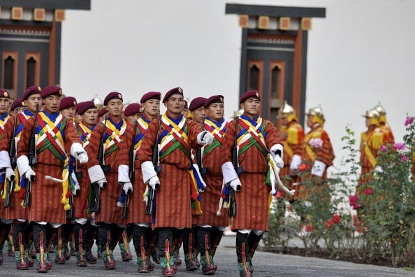 The Royal Guards of Honor take their positions at the TashichhoDzong in celebration of the wedding of The Royal Couple.