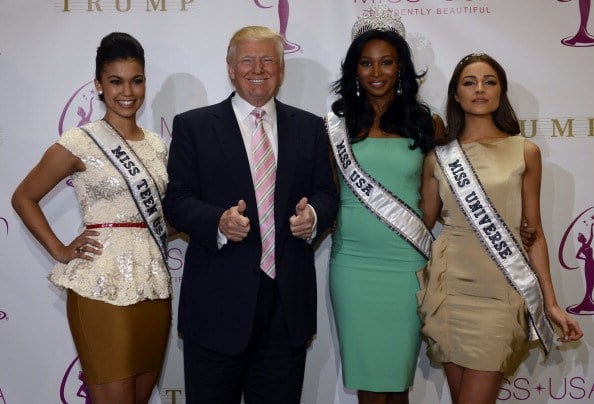 Donald Trump crowns the new Miss USA Nana Meriwether (C) alongside newly appointed Miss Universe Olivia Culpo (L) in 2013