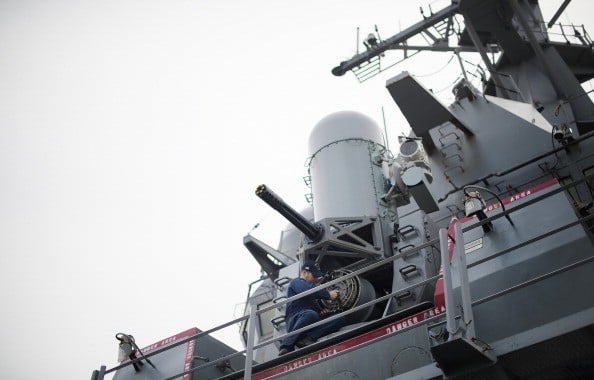 A sailor conducts maintenance on the Phalanx CIWS close-in weapon system aboard the Arleigh Burke-class guided missile destroyer USS Stout at Naval Station Norfolk in Norfolk, Virginia, May 8, 2013, during the Department of Defense's tour deemed Navy 101. AFP PHOTO/JIM WATSON