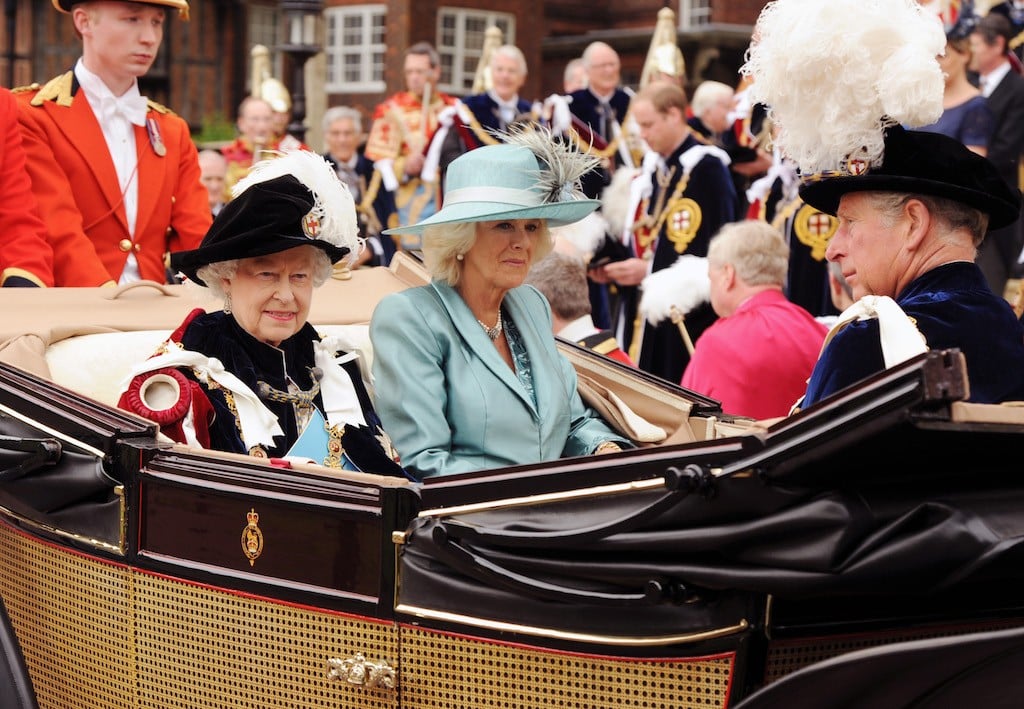Queen Elizabeth and Camilla riding in a carriage